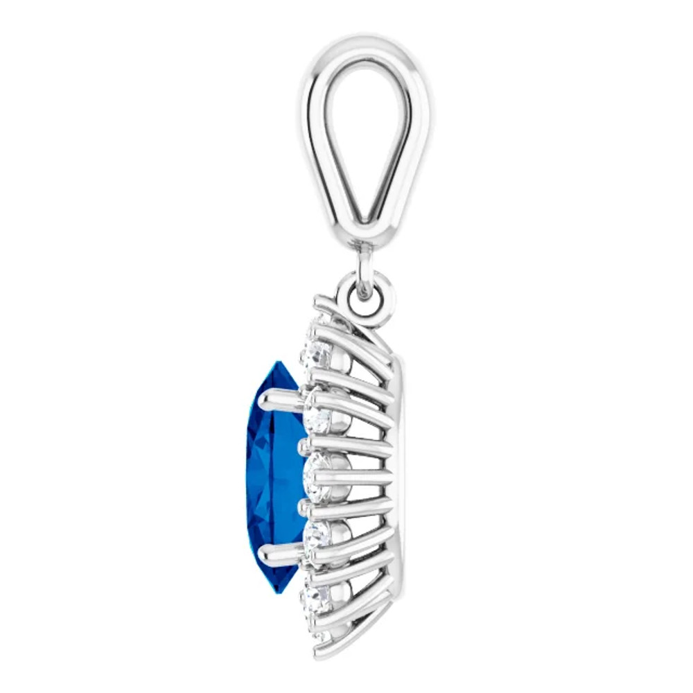 This gorgeous gemstone and diamond pendant features a 8x6mm oval shaped Blue Sapphire that is surrounded by brilliant cut round diamonds in a halo fashion. You'll love wearing it again and again.