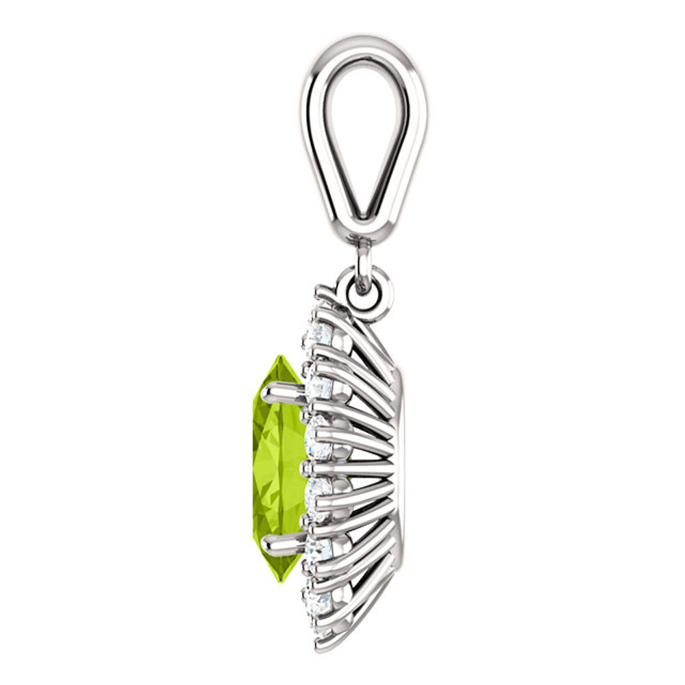 Elegant in every way, this peridot and diamond pendant features a single peridot framed by fourteen round diamonds in 14k white gold with a matching cable chain necklace.