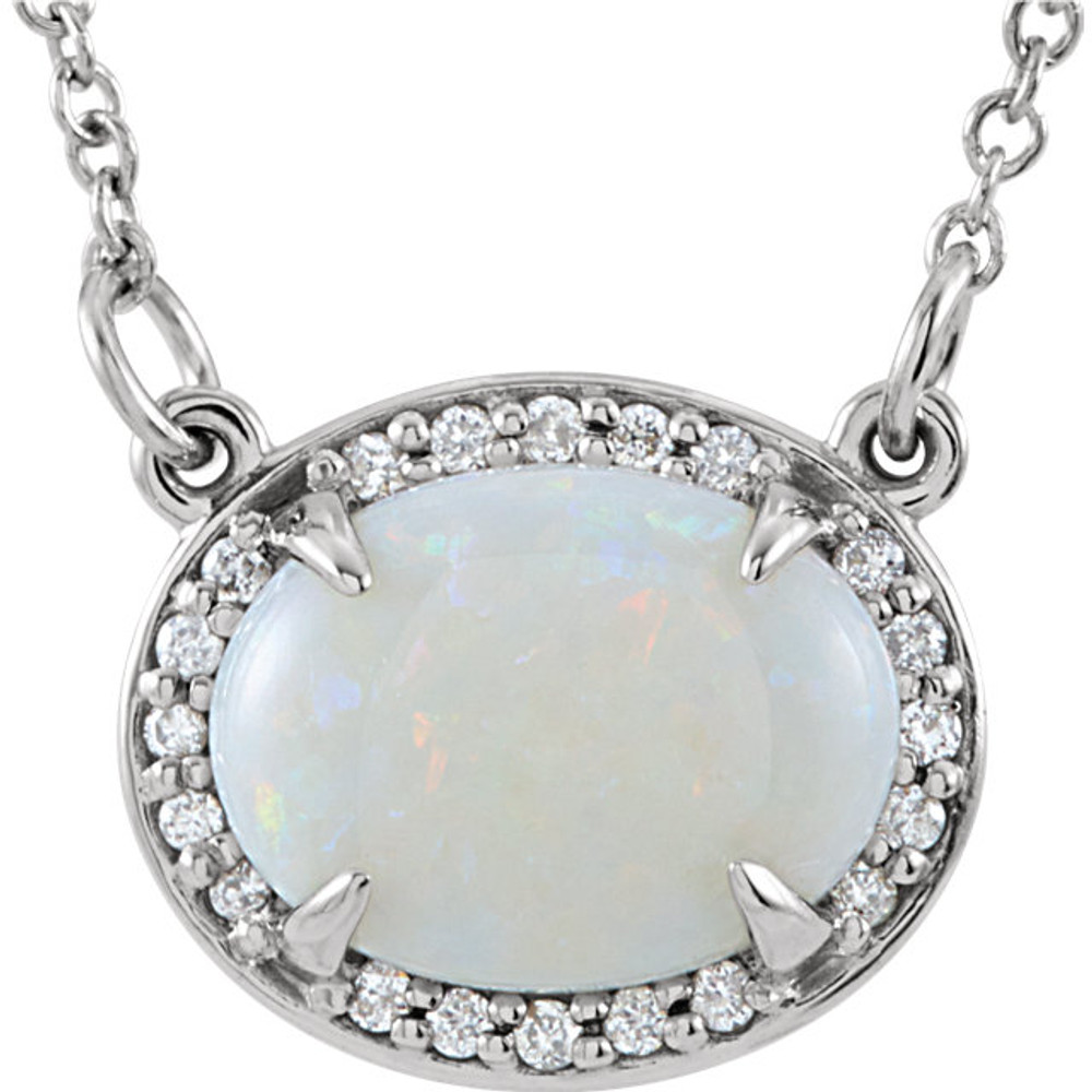 Basic and beautiful, this pendant elevates any look. Created in 14k white gold s, a beautiful frame set with shimmering white diamonds surrounds an 9.0x7.0mm genuine opal center stone. A regal look, this stylish pendant is polished to a brilliant shine and suspends along an 16.0-inch solid cable chain that secures with a spring-ring clasp.