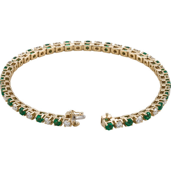 This 14kt yellow gold bracelet features twenty three 3mm genuine and natural green emeralds accented by 23 brilliant cut round near-colorless diamonds of G-H Color and I1 Clarity. The colored precious gemstones and shiny diamonds are set in a prong setting.