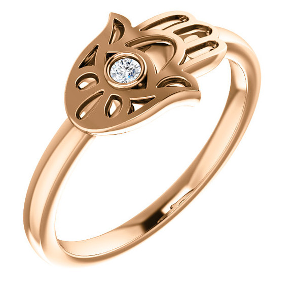 Ward off evil spirits - and be super stylish - with this diamond hamsa fashion ring in 14k rose gold.