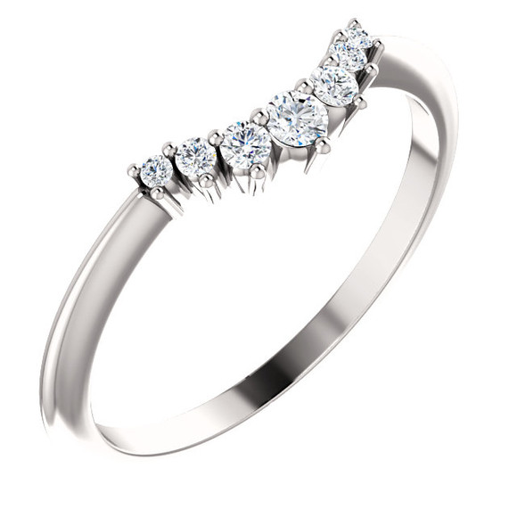 On your wedding day, speak your vows proudly as you slip this ring on her waiting finger. Fashioned in sleek platinum, this band is set with a quartet of shimmering diamonds, all totaling 1/8 ct. Slightly contoured, this band was designed to fit snuggly beneath her solitaire. Polished to a brilliant shine, it's destined to become one of her most treasured pieces.