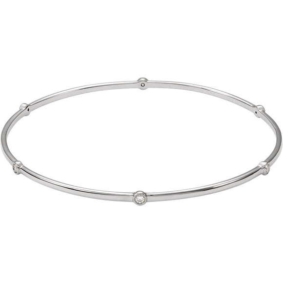 Women's bangle bracelet features a round brilliant cut natural diamond. The diamond is bezel set in solid 14k white gold.