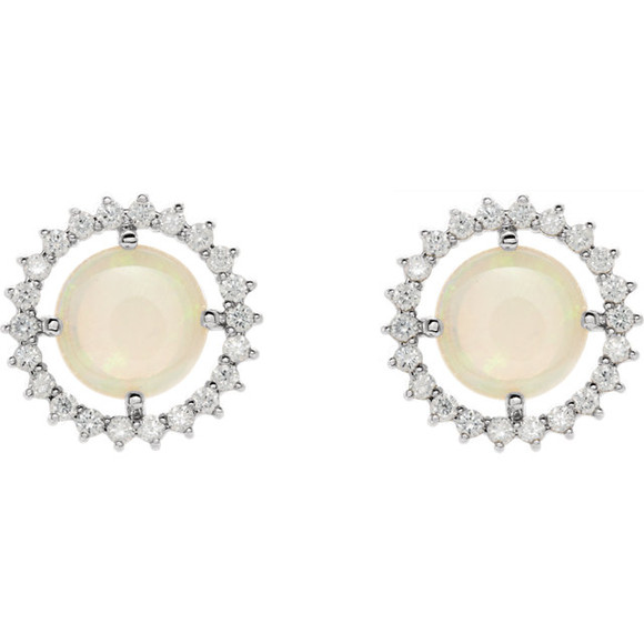 Exquisite platinum earrings capturing the beauty of a round radiant genuine opal in each surrounded by white shimmering diamonds.