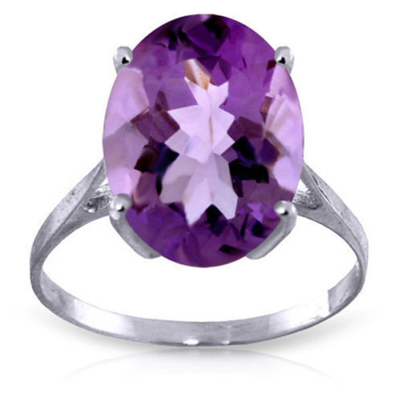  Every woman should have one big and bold piece that can give her a more polished look. This can be achieved easily when wearing this 14k gold ring with natural oval purple amethyst. A simple and elegant gold band made of high quality gold, available in yellow, white, or rose gold, hugs the finger elegantly when spotlighting this glamorous piece. An amazing 7.55 carat oval cut amethyst stone sparkles unbelievably, with a bold pop of color that can dress up any outfit. This showstopping ring makes a jaw dropping gift for those born in February.