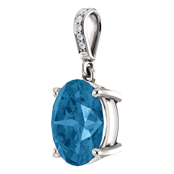This is a beautiful pendant necklace in 14K White Gold featuring a Natural; Blue Topaz Gemstone & genuine Diamonds. The pendant consist of 1 Oval Shape, 11x9 mm, Blue Topaz Gemstone with 6 Accent genuine Diamonds. It is presented on an 18" 14K White Gold Diamond Cut Cable Chain. This necklace is both Elegant and Classic - Perfect for everyday. The inherent beauty of these gems make this an ideal way for you to show your love to someone you care for.