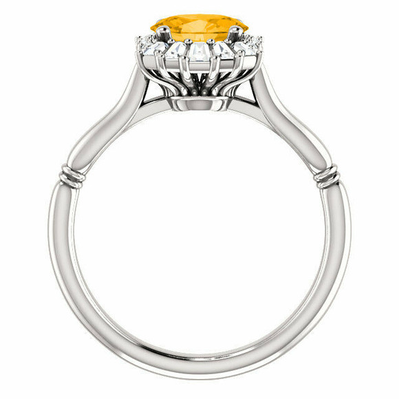 Crafted in sterling silver, this ring features one oval Genuine Citrine gemstone accented with 18 genuine diamonds. 