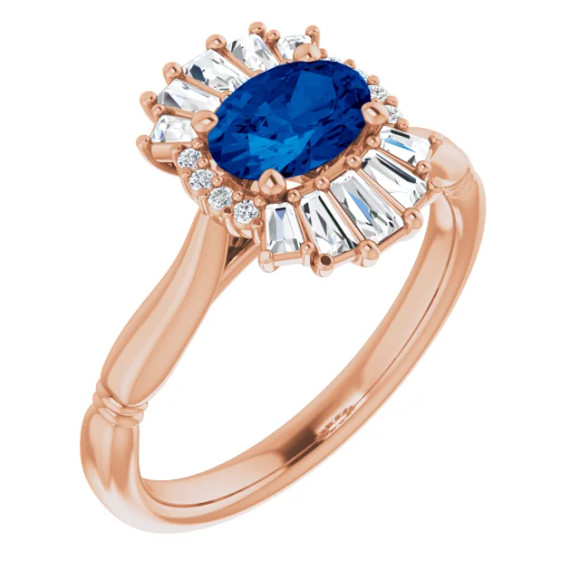 Crafted in 14k rose gold, this ring features one oval Genuine Blue Sapphire gemstone accented with 18 genuine diamonds.