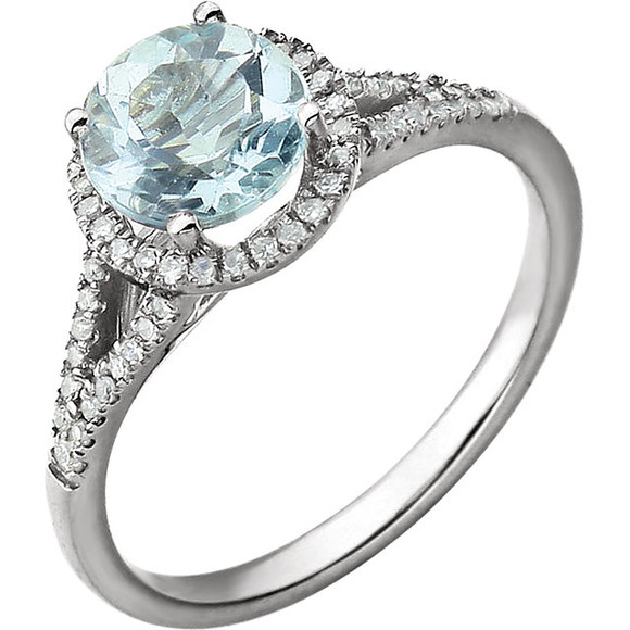 Beautiful Halo-style Gemstone Ring in 14K White Gold featuring a Natural Aquamarine Gemstone & Diamonds. The ring consist of 1 Round Shape, 7.0 mm, Aquamarine Gemstone with 56 Accent genuine Diamonds. This ring is both Elegant and Classic - Perfect for everyday. The inherent beauty of these gems make this an ideal way for you to show your love to someone you care for.