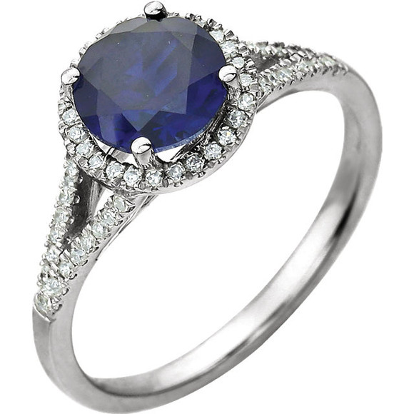 Beautiful Halo-style Gemstone Ring in 14K White Gold featuring a created blue sapphire ring Gemstone & Diamonds. The ring consist of 1 Round Shape, 7.0 mm, Created Blue Sapphire Gemstone with 56 Accent genuine Diamonds. This ring is both Elegant and Classic - Perfect for everyday. The inherent beauty of these gems make this an ideal way for you to show your love to someone you care for.