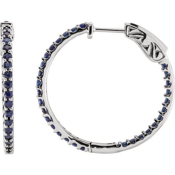 Designed with the September-born birthday girl in mind, these glam and glistening hoops are perfect for her vivacious personality. Fashioned in 14K White Gold, these hoops feature an array of shimmering bright blue sapphires set along the inside and outside edges. Brilliant from every angle, these polished hoops secure comfortably with hinged backs.