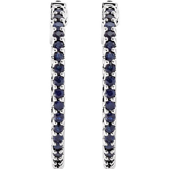 Designed with the September-born birthday girl in mind, these glam and glistening hoops are perfect for her vivacious personality. Fashioned in 14K White Gold, these hoops feature an array of shimmering bright blue sapphires set along the inside and outside edges. Brilliant from every angle, these polished hoops secure comfortably with hinged backs.