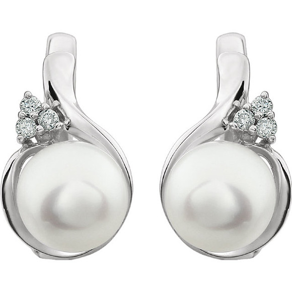 These elegant 14k white gold earrings each feature a white round freshwater pearl with diamond accents. Diamonds are .08ctw, H-J in color, and I3 or better in clarity. Earrings are 17.50mm in length and 10.20mm in width.