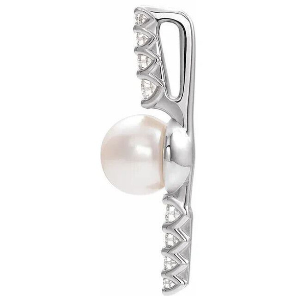 Make a bold and modern fashion statement with this cultured freshwater pearl & Diamond Pendant in 14k white gold showcased by 8 sparkling accent diamonds set off by a singular freshwater cultured freshwater pearl.

Cultured freshwater pearls measure approximately 6mm to 6.5mm in diameter. Diamonds are rated I1 for clarity, G-H for color, with 1/6 total carat weight.