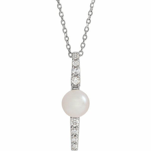 Make a bold and modern fashion statement with this cultured freshwater pearl & Diamond Pendant Necklace in platinum showcased by 8 sparkling accent diamonds set off by a singular freshwater cultured freshwater pearl.

Cultured freshwater pearls measure approximately 6mm to 6.5mm in diameter. Diamonds are rated SI2-SI3 for clarity, G-H for color, with 1/6 total carat weight.

This distinctive pendant comes suspended on a platinum chain in your choice of lengths (16" or 18"), secured with a ring clasp.