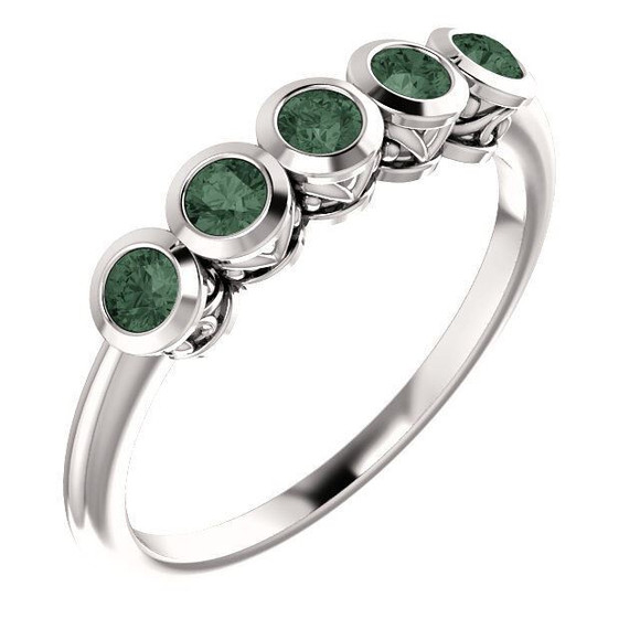 Crafted in sterling silver, this ring features 5, round, alexandrite gemstones.