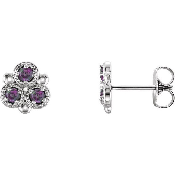 Mesmerizing with magical color, this pair of lab-grown alexandrite three-stone earrings make a stylish statement.