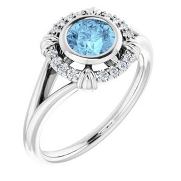 Dainty and feminine, this gemstone ring sets an elegant tone. The ring is set in platinum.