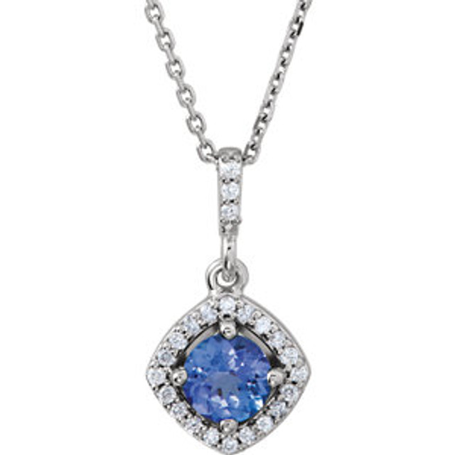 Our designer inspired 1/8 ct. tw. round cut tanzanite styled 18" tanzanite halo necklace is a perfect match for today's style. A true statement piece, this Necklace sets a sophisticated tone. Fashioned in sleek 14kt white gold. This magnificent piece sparkles with shimmering halo round cut tanzanite. 1/8 ct. This necklace is 18" and simply stunning, captivating like no other.