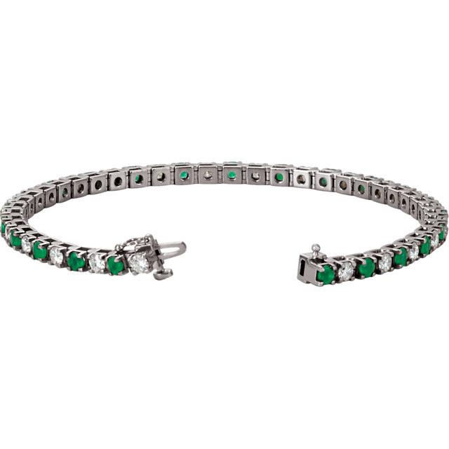 This 14kt white gold bracelet features twenty three 3mm genuine and natural green emeralds accented by 23 brilliant cut round near-colorless diamonds of G-H Color and I1 Clarity. The colored precious gemstones and shiny diamonds are set in a prong setting.