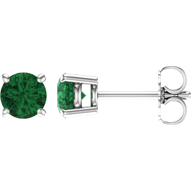 Lush with the dark green hue of nature itself, Emeralds pulse with vitality and are representative of life and excitement. This simple stud design features a 5mm genuine emerald cradled in a 4-prong basket of 14k white gold finished with a tension back post. Total carat weight for the pair is 1.40.