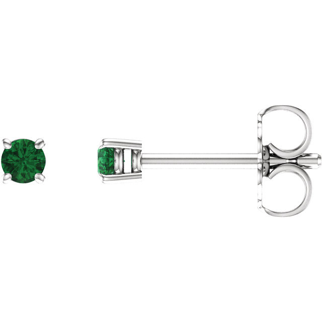 Delicate in design, these petite emerald stud earrings feature a pair of hand-selected classic green emeralds complemented by 14k white gold four-prong settings.