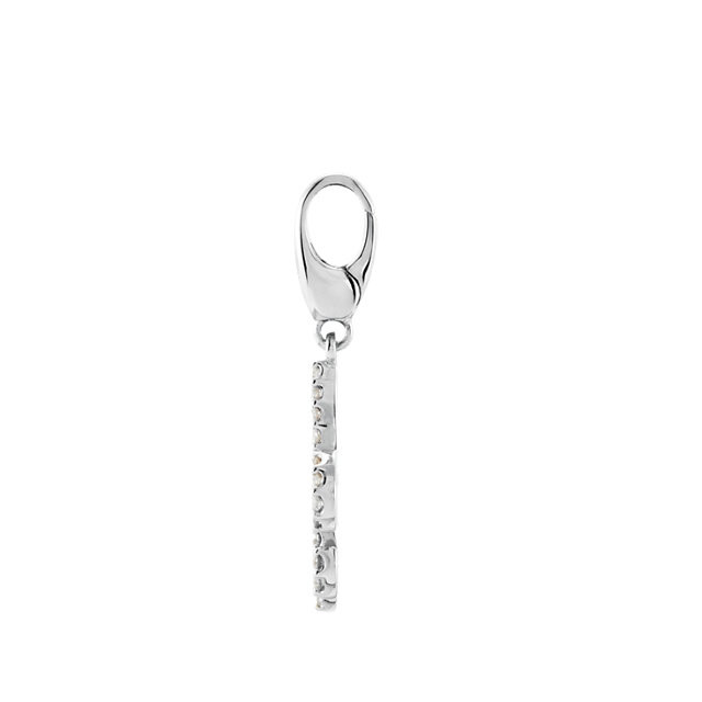 Add a touch of royal glamour to your style with this symbolic Fleur- de-Lis charm fashioned from 14k white gold. It is prong set with 47 full cut round diamonds. The petite charm has a total diamond weight of 1/4 carat. The diamonds are I1 in clarity and G-H in color. (Chain is not included). Polished to a brilliant shine.