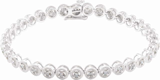 Sparkling, brilliant cut diamonds are set in a classic 14k white gold, tennis 7" bracelet.