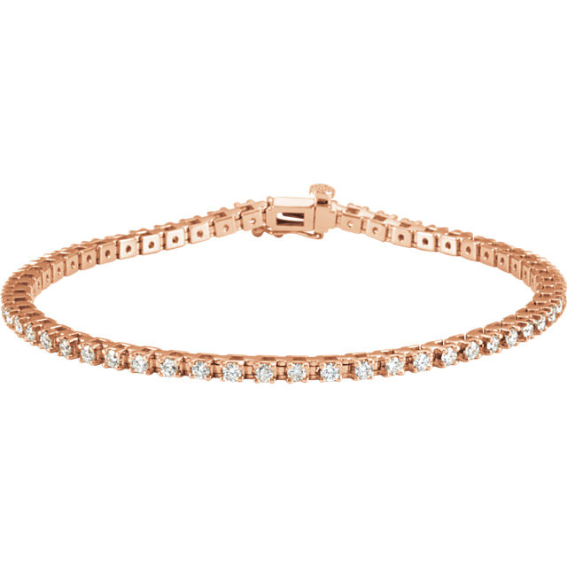 Sparkling, brilliant cut diamonds are set in a classic 14k rose gold, four-prong 7.25" tennis bracelet.