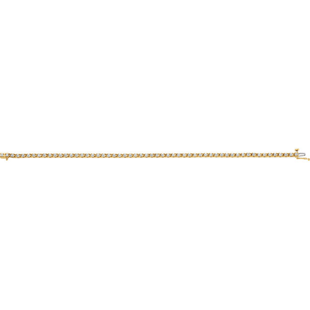Sparkling, brilliant cut diamonds are set in a classic 14k yellow gold, four-prong 7.25" tennis bracelet.
