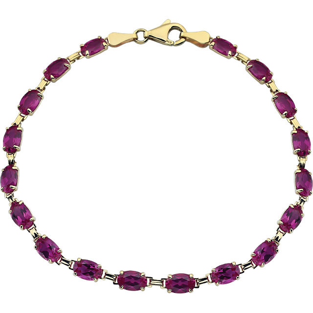 Brilliant oval created rubies set in 14k yellow gold in this eye-catching bracelet.
