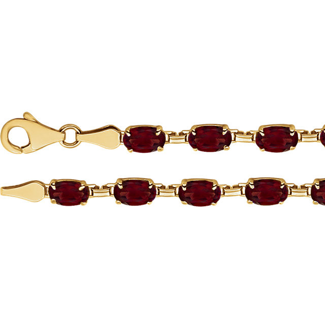 Brilliant oval genuine mozambique garnet's 6x4mm are set in 14k yellow gold in this eye-catching bracelet.