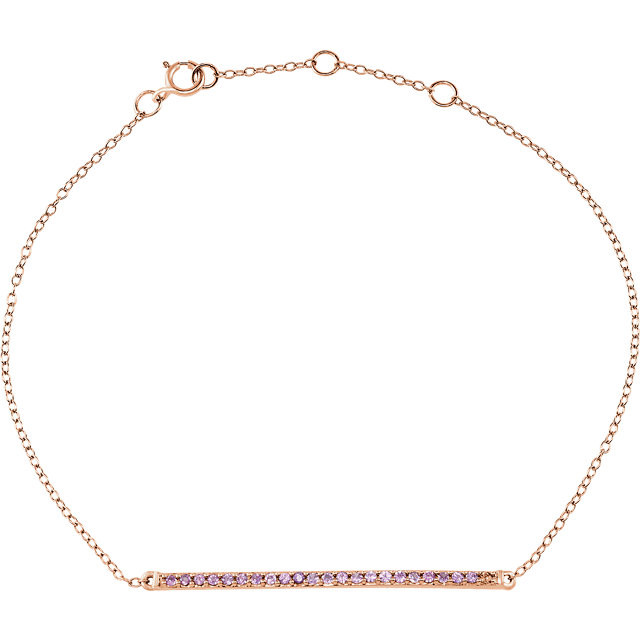 A modern design is captured in this 14Kt rose gold bracelet with a stylish bar design set with pink sapphires.