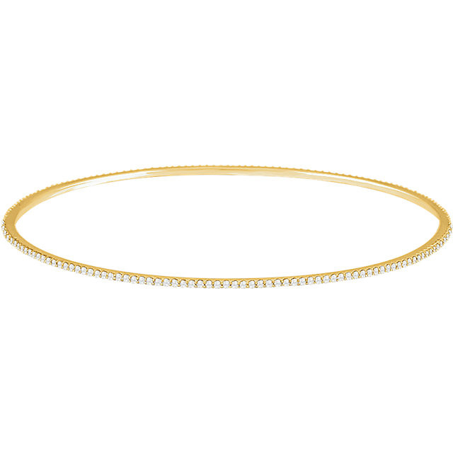 Elegant 14Kt yellow gold diamond bangle bracelet featuring a sparkling display of white round diamonds. Total weight of the diamonds is 1.00cts. Total weight of the gold is 5.75 grams.