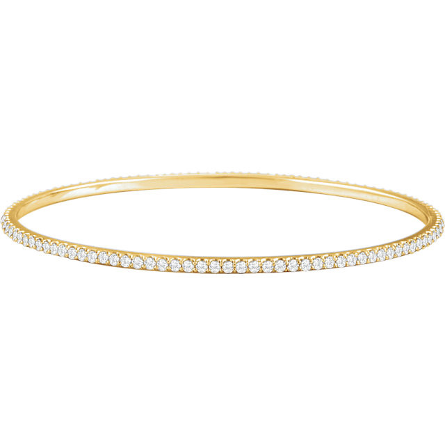 Elegant 14Kt yellow gold diamond bangle bracelet featuring a sparkling display of white round diamonds. Total weight of the diamonds is 3.00cts. Total weight of the gold is 9.05 grams.