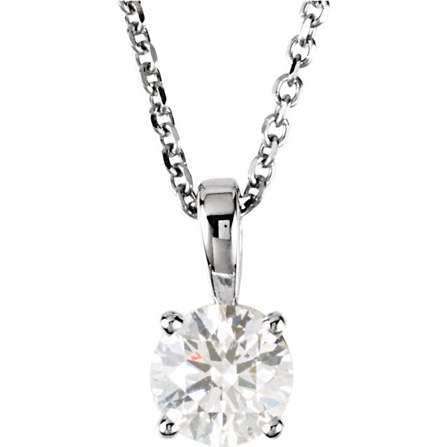 The elegant look of a dazzling solitaire diamond pendant is a jewelry essential in every women's collection. A fiery Round Cut diamond is securely prong set onto a lustrous 14K White Gold setting. The sparkling Round diamond weighs 3/4 ct.(Diamond Color G-H (near colorless), Clarity SI2-SI3) and is suspended in pure elegance on an 18 inch chain.