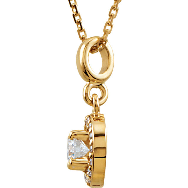 If you want to make a real entrance, don this dramatic diamond pendant necklace. All eyes will be on you and your jeweled d'colletage. You will be instantly transfixed into the one they all want to know even if they are not the actual guest of honor. Set in 14K yellow gold, this pendant weighs 1/4 ct. tw. and has a bright polish to shine.