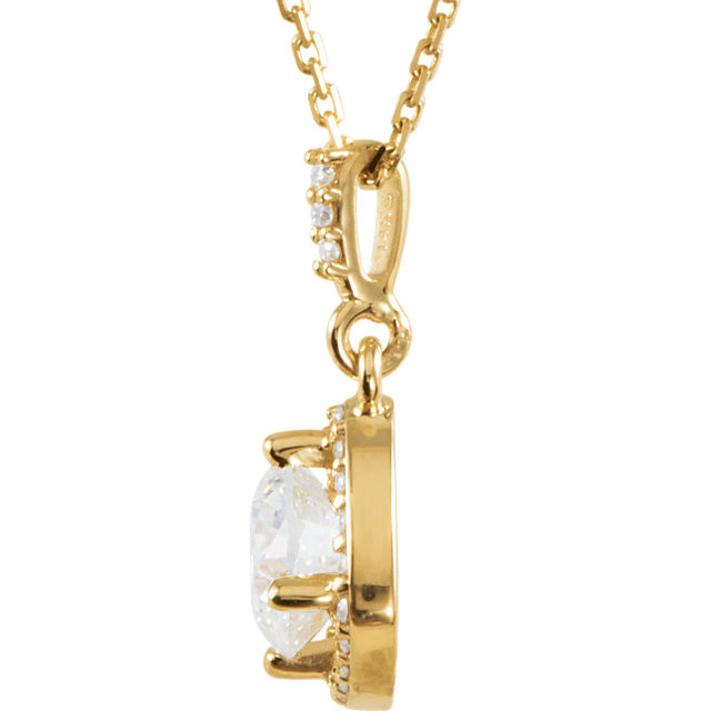 An impressive round diamond framed in additional round diamonds is the focal point of this extraordinary necklace for her. The pendant, fashioned in 14K yellow gold, is suspended from an 18-inch chain secured with a spring ring clasp. The total diamond weight is 1 1/6 carats.