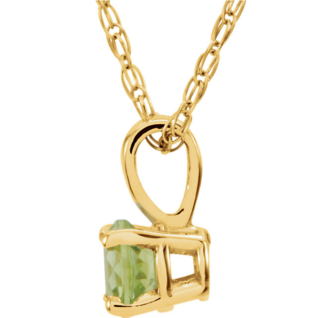 Peridot is the gem most often used to celebrate those born in August and as the popularity of lime green continues to grow, so does the youthful appeal of this citrus-hued gem. This classic 14-inch girls necklace features a faceted 3mm round gemstone in a four-prong basket setting and a 0.75mm laser welded loose rope chain finished with a spring-ring clasp made of 14k yellow gold. The genuine peridot is untreated and the stone weight is approximately 1/8 carat. The color range varies on all natural stones so please allow for slight variations in shades.