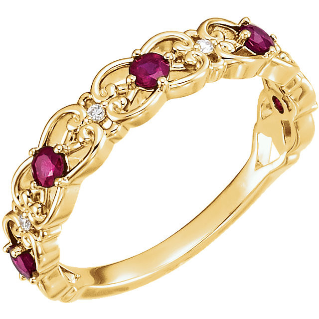 Truly beautiful design is found in this 14Kt yellow gold ring featuring red rubies and diamonds. Total weight of the gold is 3.10 grams.