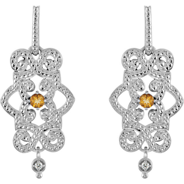 Wonderful 14Kt white gold dangle earrings with genuine citrine and full cut diamonds. Diamonds are G-H in color and I1 or better in clarity. Polished to a brilliant shine.