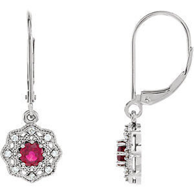 You'll feel like royalty in these breathtaking genuine ruby drop earrings, enhanced by 1/8 ct. t.w. diamonds and a 14K white gold setting.