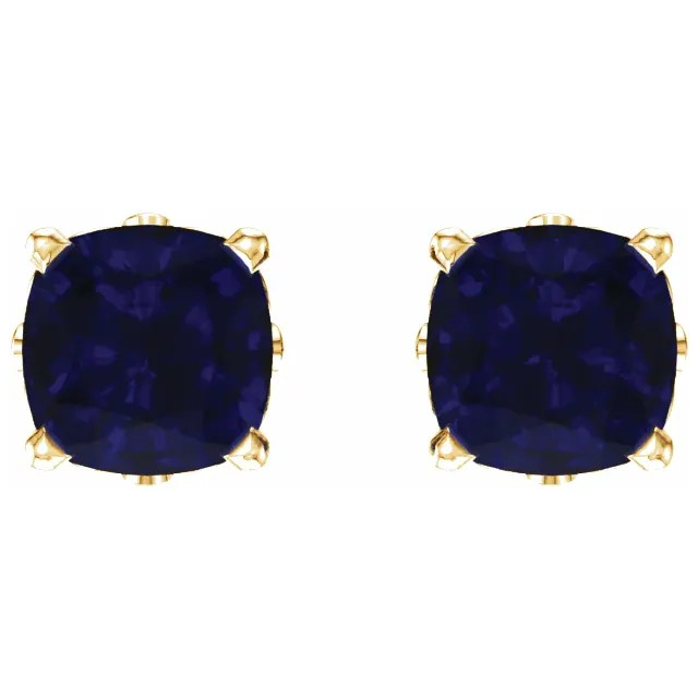 Deeply rich in color, these blue sapphire earrings are complemented by 14k yellow gold four-prong settings and make a simply striking gift.