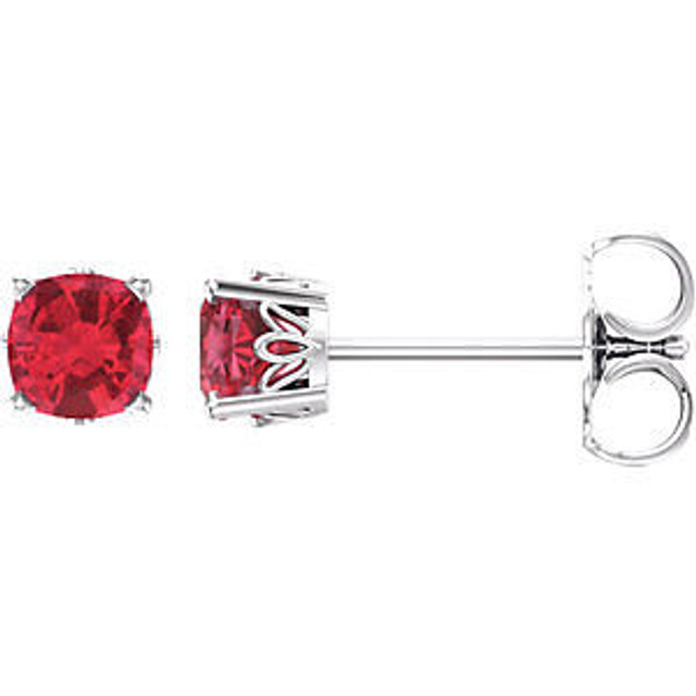 Fiery and romantic! This simple stud design features a 4 x 4mm cushion-cut created ruby cradled in a 4-prong basket of 14k white gold finished with a tension back post. Total carat weight for the pair is 0.90.