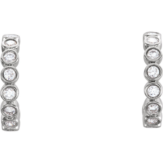 Perfect for a look of sheer elegance, these diamond bezel set hoop earrings feature gorgeous diamonds framed in striking Platinum.