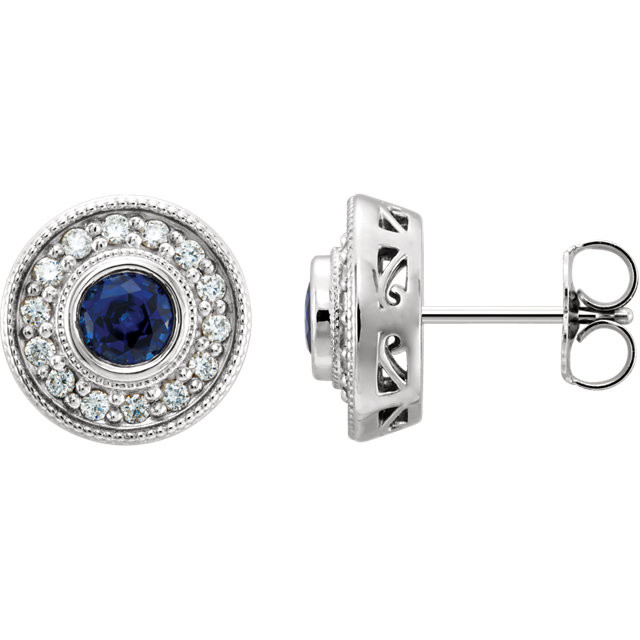 Exquisite 14Kt white gold earrings capturing the beauty of a round radiant blue sapphire in each surrounded by white shimmering diamonds.