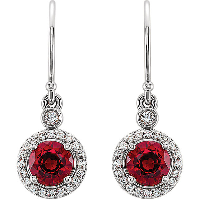 Wonderful 14Kt white gold halo-style earrings capturing the beauty of Chatham® created ruby surrounded by .08 carat total weight of white diamonds. 