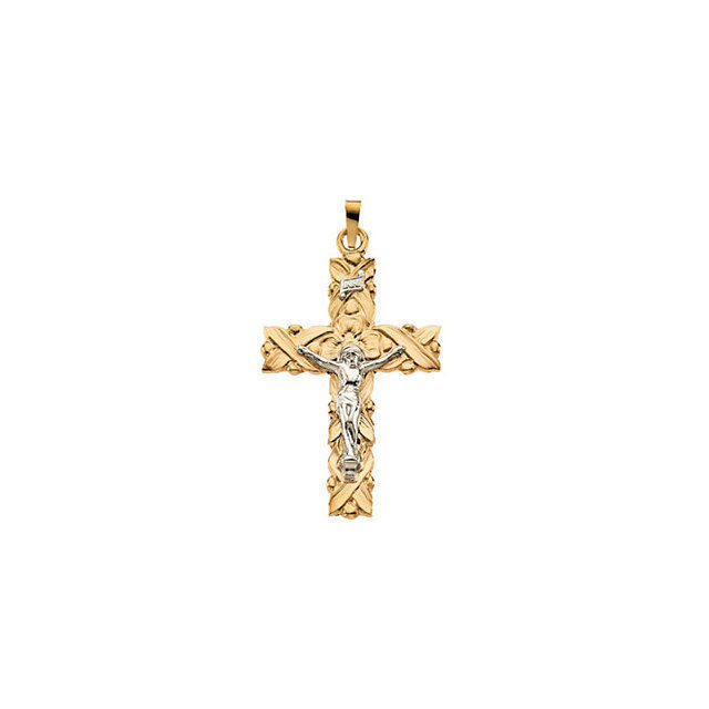 Comforting charm. This crucifix pendant features intricate design and beautiful 14k gold and 14k white gold. Chain sold separately!