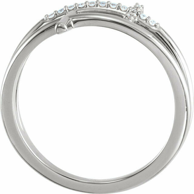 This sideways cross ring features 15 sparkling diamonds set in platinum.