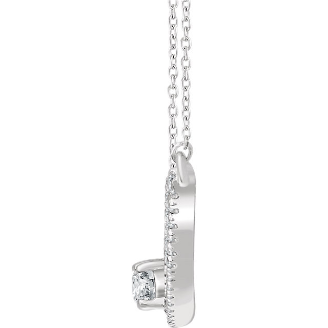 Chic and sparkling, this diamond two stone necklace features round diamonds in 14k white gold, and a matching cable chain. This necklace can be worn at 16 or 18 inches in length.